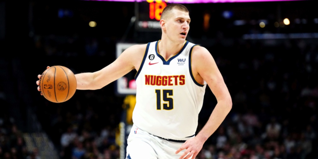 Jokic posts triple-double by halftime, Nuggets rout Wolves