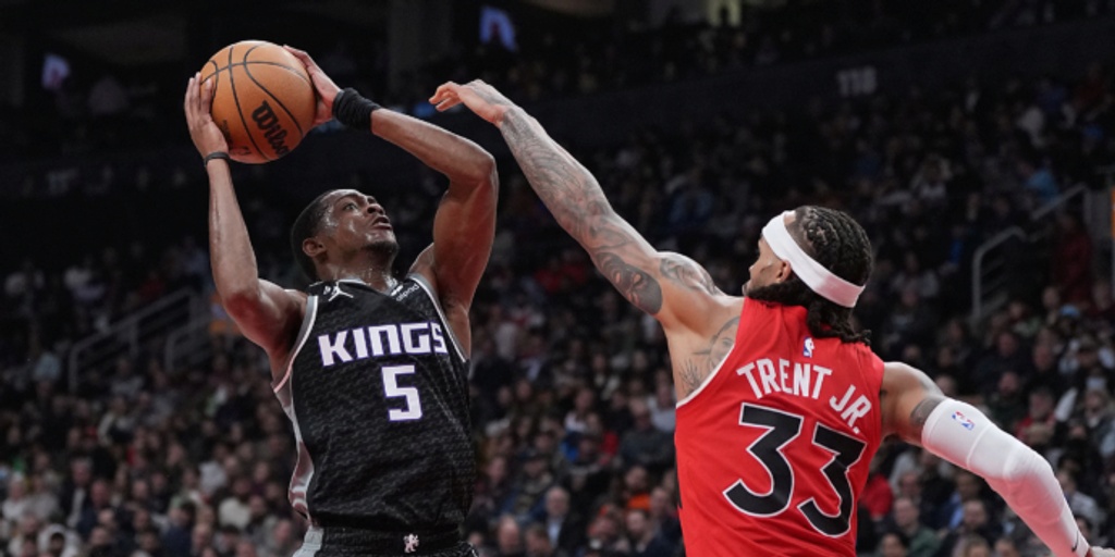 Fox has 27 points and 10 assists, Kings beat Raptors 124-123