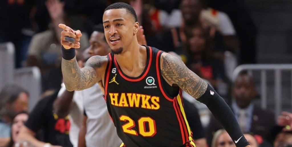 Hawks clear cap room by trading Collins to Jazz for Gay, 2nd rounder