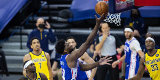 Joel Embiid to undergo MRI after going down with knee injury