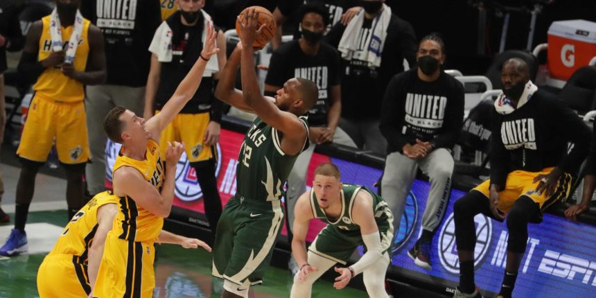 Khris Middleton lifts Bucks past Heat in overtime in Game 1