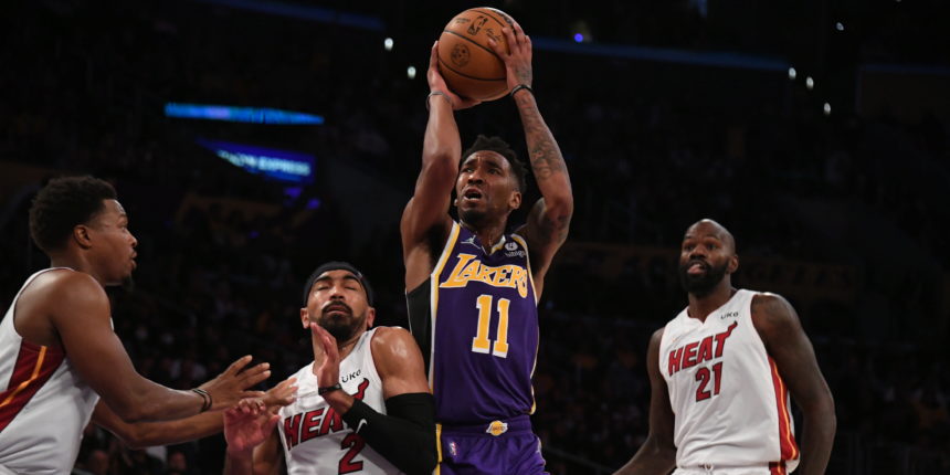 Lakers rally late in regulation, hold off Heat 120-117 in OT